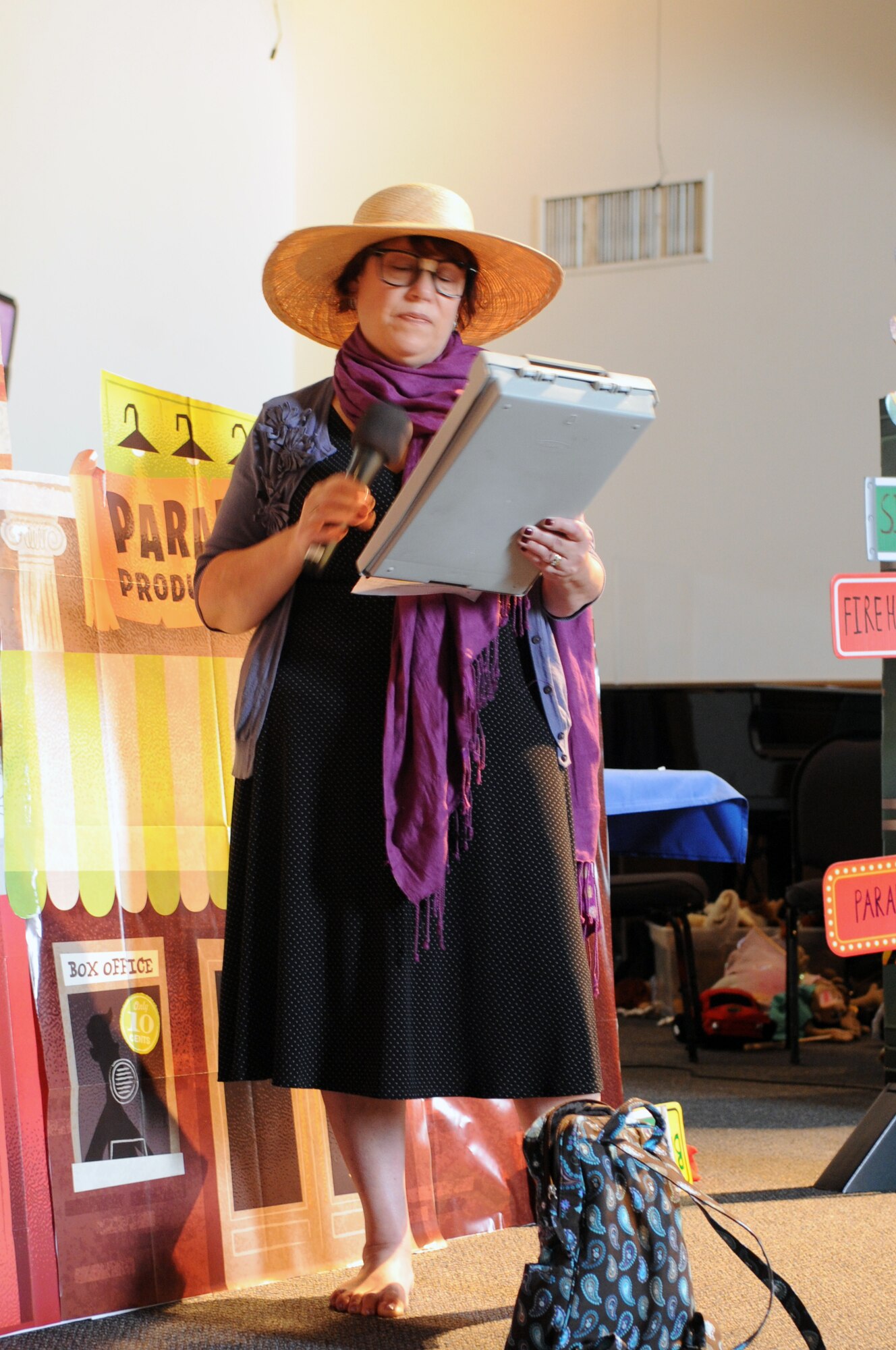VANDENBERG AIR FORCE BASE, Calif. -- Diane Banner, from the Wing Chapel, performs a skit during a Vacation Bible School class here Tuesday, June 14, 2011. This year’s “Inside Out & Upside Down on Main Street” themed VBS uses parables to connect a Bible story and verse to the Word on the Street. Children of all religious backgrounds are invited to attend. (U.S. Air Force photo/Jerry E. Clemens, Jr.)