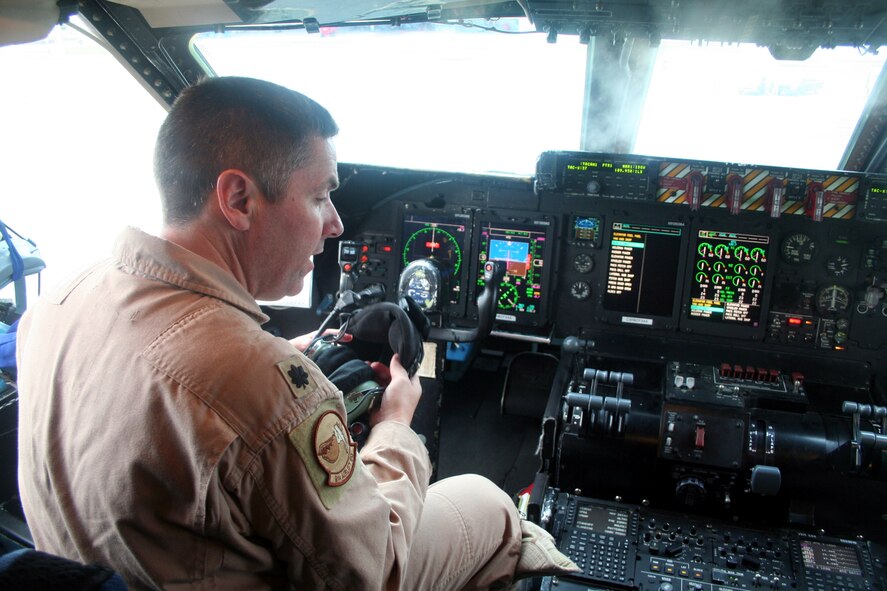 Lt. Col. Thomas Loper, C-5 pilot, prepares a C-5M Super Galaxy for a mission on June 5, 2011. The plane was departing for the Air Force's first direct delivery airlift mission through the Arctic Circle from Dover Air Force Base, Del., to Bagram Airfield, Afghanistan. Colonel Loper is the 436th Airlift Wing director of staff at Dover AFB.  (U.S. Air Force Photo/Master Sgt. Scott T. Sturkol)