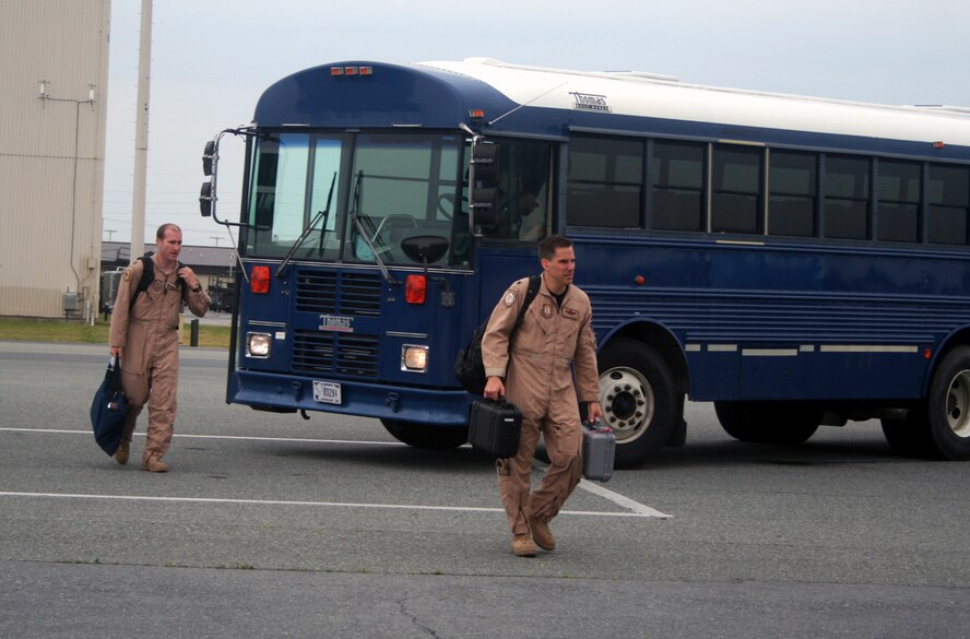 Active duty and Air Force Reserve aircrew Airmen prepare to board a C-5M Super Galaxy on June 5, 2011, prior to the plane's departure for a direct delivery airlift mission through the Arctic Circle from Dover Air Force Base, Del., to Bagram Airfield, Afghanistan. The Airmen were from the 9th Airlift Squadron, 709th Airlift Squadron and the 436th Aircraft Maintenance Squadron at Dover AFB. (U.S. Air Force Photo/Master Sgt. Scott T. Sturkol)