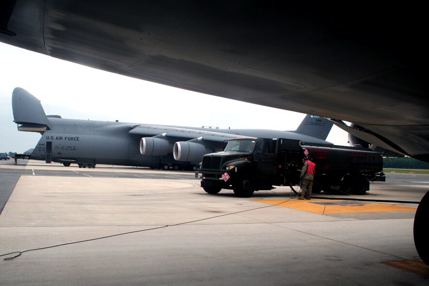Fuels distribution Airmen from the 436th Logistics Readiness Squadron fuel a C-5M Super Galaxy on June 5, 2011, prior to the plane's departure for a direct delivery airlift mission through the Arctic Circle from Dover Air Force Base, Del., to Bagram Airfield, Afghanistan. (U.S. Air Force Photo/Master Sgt. Scott T. Sturkol)