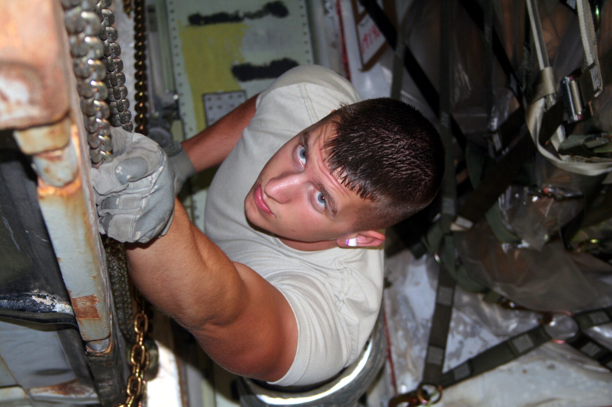 Airman 1st Class Brett Kiser, air transportation journeymen from the 436th Aircraft Aerial Port Squadron, checks on cargo on a C-5M Super Galaxy on June 5, 2011, prior to the plane's departure for a direct delivery airlift mission through the Arctic Circle from Dover Air Force Base, Del., to Bagram Airfield, Afghanistan. Airman Kiser is a native of Tillamook, Ore.(U.S. Air Force Photo/Master Sgt. Scott T. Sturkol)