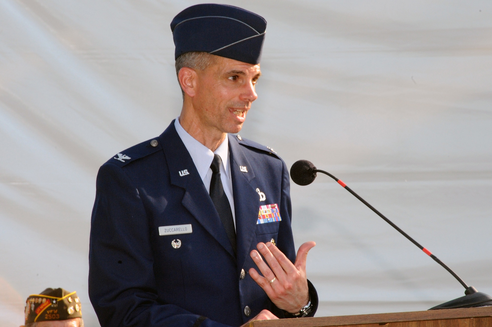 OMAHA, Neb. -- Col. Louis Zuccarello, Air Force Weather Agency vice commander, addresses the crowd at Memorial Park June 5, as part of the closing ceremonies of the Traveling Vietnam Veterans Memorial and Museum that made a stop here from May 29 - June 5. Thanks to the Heroes of the Heartland Foundation, the wall made its way here and from across the region came family members, local dignitaries, elected officials and veterans to pay their respects to the more than 58,000 names that reside on it. (Air Force photo by Kendra Williams/Released)
