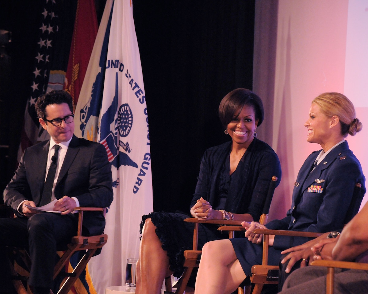 Capt. Kelly Smith, C130 pilot with the 146th Airlift Wing, speaks with First Lady Michelle Obama and J.J. Abrams, a Hollywood writer/producer, during a panel discussion held June 13, 2011 at the Writers Guild Theater in Beverly Hills. The First Lady asked writers and producers in the film industry to support the military and their families by sharing their compelling stories in their plotlines. (Photo by Master Sgt. Dave Buttner)