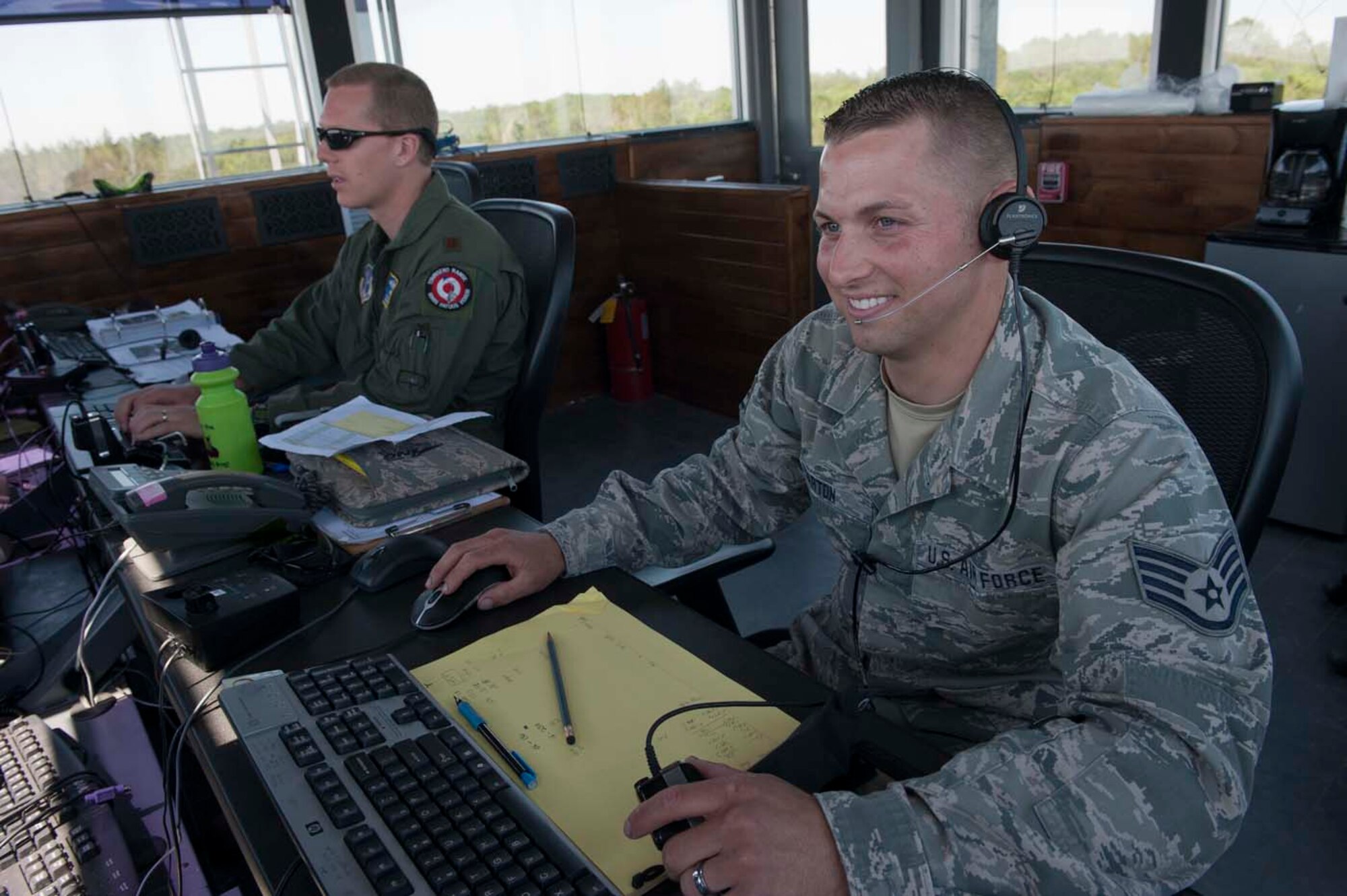 PEDAL TO THE METAL - Working the tower at Townsend Bombing Range, Ga., Barton had to cross-train from tactical air control party to cyber transporter after the motorcycle mishap severed his leg. (Photo by TSgt Samuel Bendet)
