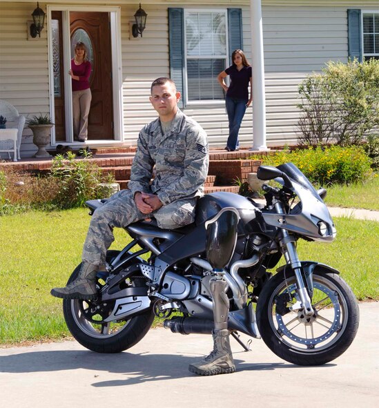 PEDAL TO THE METAL - Barton needed more than a leg to stand on to get through grueling rehab; he needed a strong support system, which he got in the form of family members like his mom, Wanda (left) and wife, Megan.
(Photo by TSgt Samuel Bendet)