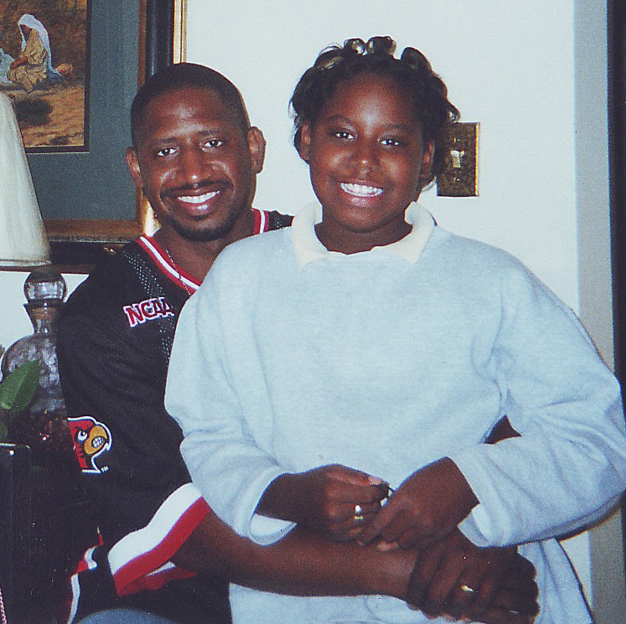 Tech. Sgt. Maurice Britt spends time with his daughter Dania before he was killed by a drunk driver, April 5, 2009.