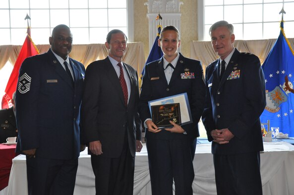 Chief Master Sgt. John Carter, Conn. State Command Chief—JFHQ, U.S. Senator for Connecticut, Richard Blumenthal and Maj. Gen. Thad Martin, The Adjutant General, pose with Master Sgt. Carrie Traverse, 103rd Air Control Squadron, after she was recognized for distinguished service during the 62nd annual Armed Forces Day Luncheon at the Aqua Turf Club in Southington May 20, 2011. (Photo by 2nd Lt. Emily Hein)