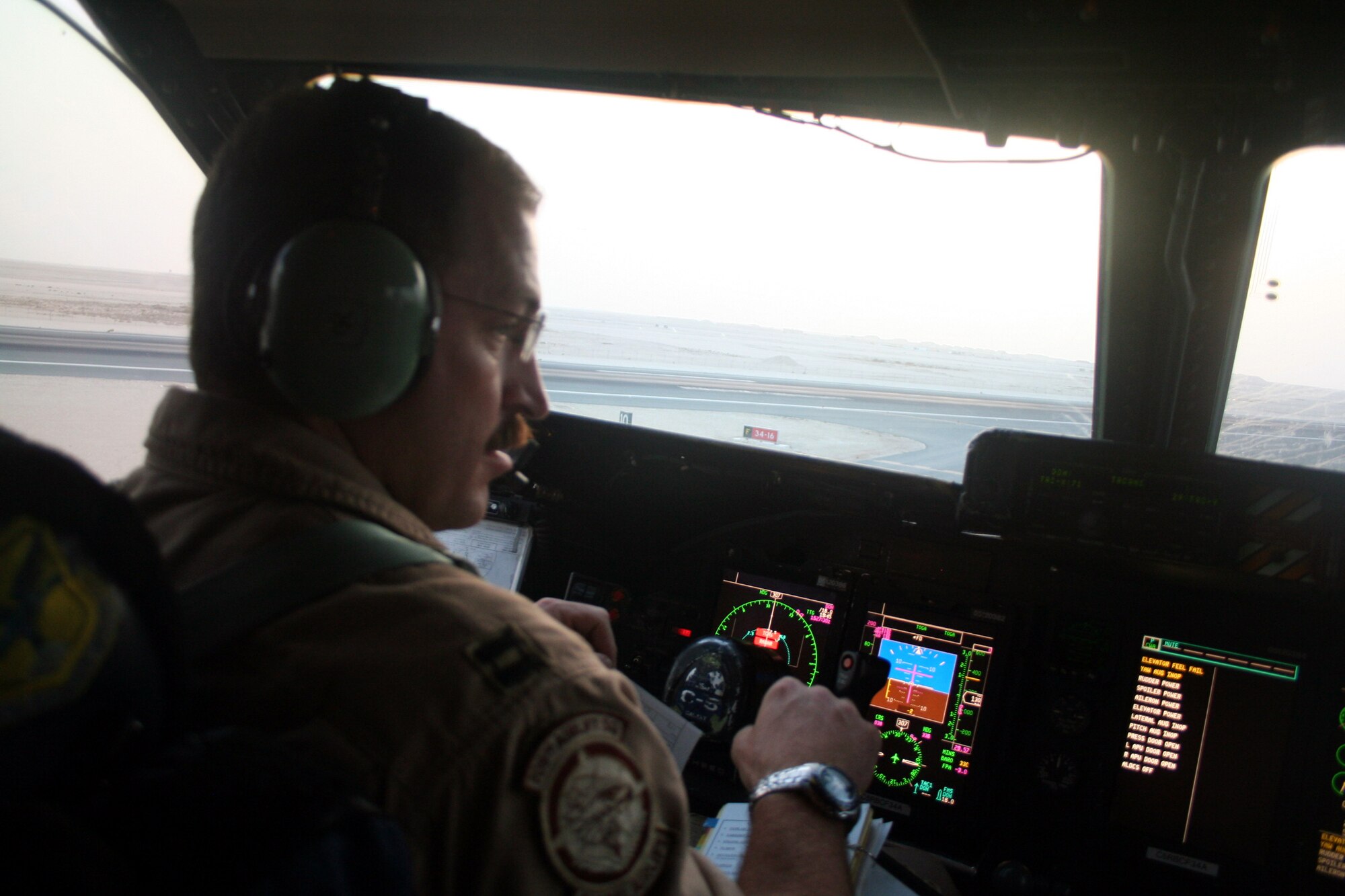 Capt. Brian Marasco, C-5 pilot, prepares a C-5M Super Galaxy for a combat airlift mission from a non-disclosed location in Southwest Asia on June 7, 2011. Captain 
Marasco, an Air Force Reservist from the 709th Airlift Squadron at Dover Air Force Base, Del., was transiting through the U.S. Central Command area of responsibility moving cargo between several locations. On June 5 to  6, 2011, Captain Marasco was one of 14 crew members to fly on the first Arctic overflight mission from Dover AFB to Bagram Airfield, Afghanistan.  (U.S. Air Force Photo/Master Sgt. Scott T. Sturkol)