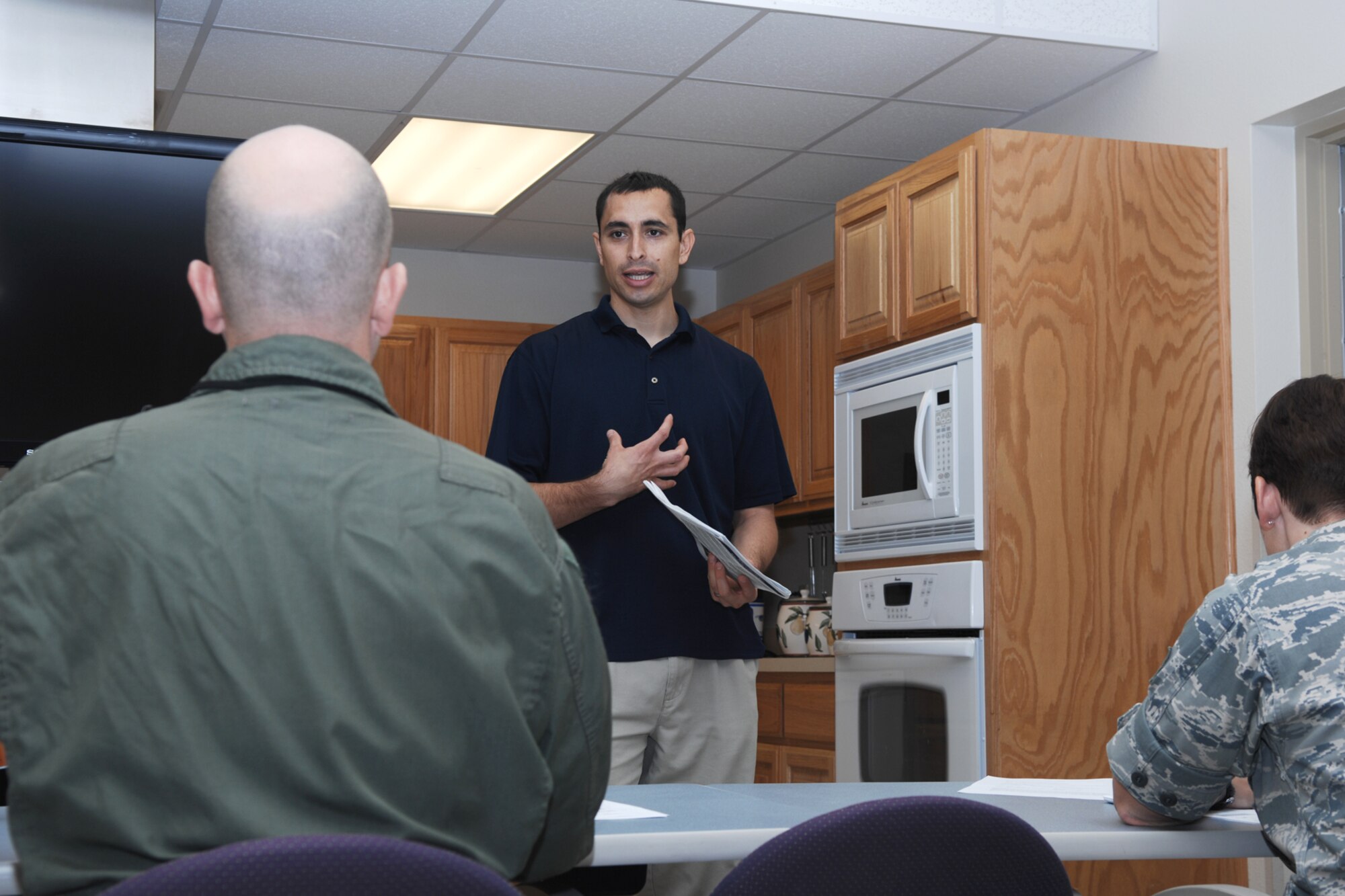 GOODFELLOW AIR FORCE BASE, Texas -- Carlos Sifuentes, Health and Wellness Center health promotion educator, conducts a Be Well class June 14. The Be Well class is a revitalized version of the Healthy Living Program class and consists of three educational components fitness, nutrition, and behavior changes. (U.S. Air Force photo/Staff Sgt. Laura R. McFarlane)

