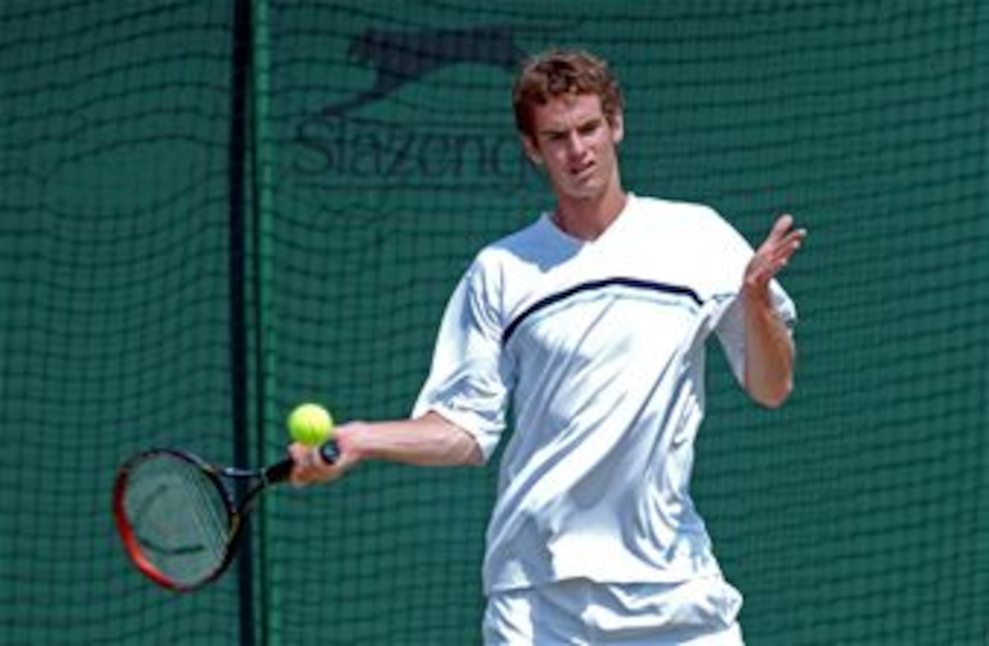 Andy Murray of Scotland prepares to hit a shot on the practice courts during the 2005 Wimbledon Championships held in London, England. (Photo courtesy of Tony Tolley) 
