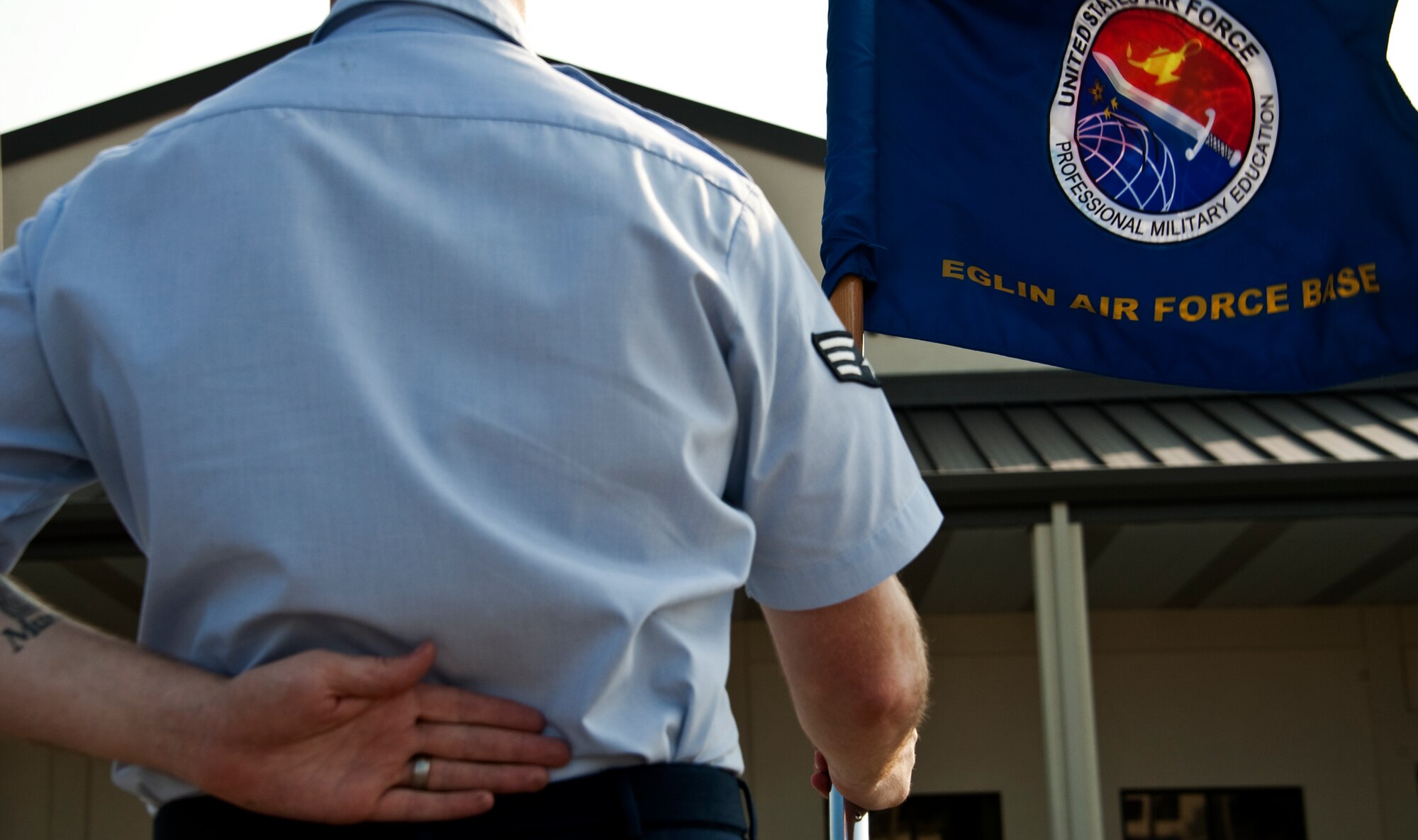 A guidon bearer stands at parade rest prior to the morning Reveille ceremony at Eglin’s Airman Leadership School June 13.  ALS is a five-week long Air Force program designed to develop Airmen into effective front-line supervisors.  It is the first professional military education enlisted Air Force members encounter.  Eglin's schoolhouse hosts seven ALS classes per year.  Eglin was named Air Force Materiel Command's PME program of the year for 2009 and 2010.  (U.S. Air Force photo/Samuel King Jr.)