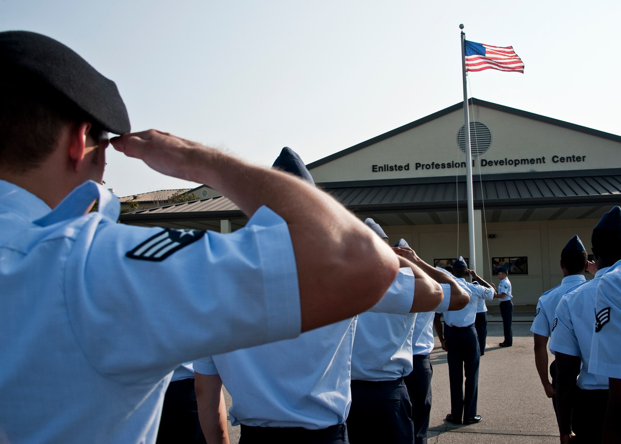 Students in the latest Airman Leadership School class salute the flag during a morning Reveille ceremony at Eglin’s Airman Leadership School June 13.  ALS is a five-week-long Air Force program designed to develop Airmen into effective front-line supervisors.  It is the first professional military education enlisted Air Force members encounter. Eglin's schoolhouse hosts seven ALS classes per year.  Eglin was named Air Force Materiel Command's PME program of the year for 2009 and 2010. (U.S. Air Force photo/Samuel King Jr.)
