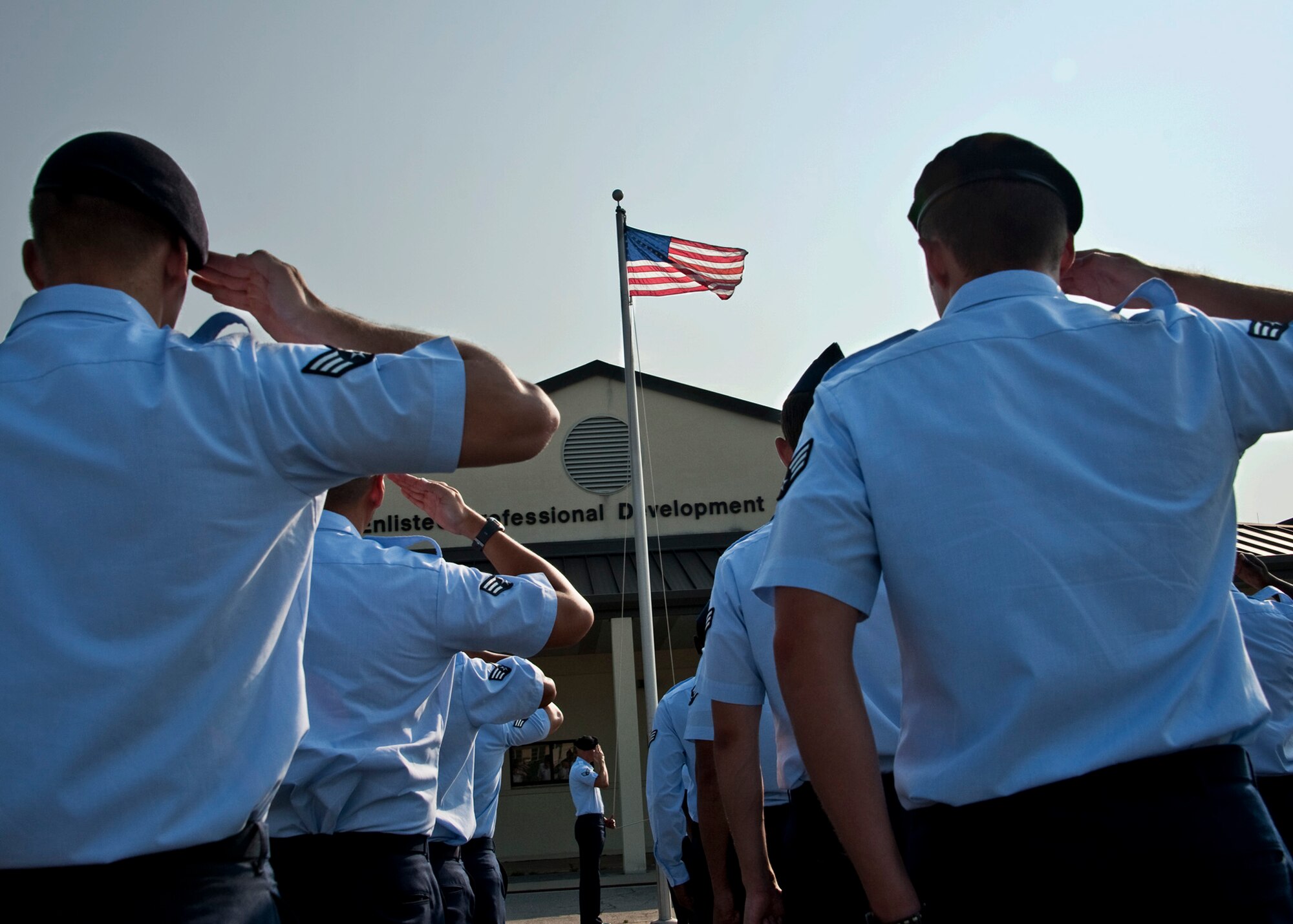 Students in the latest Airman Leadership School class salute the flag during a morning Reveille ceremony at Eglin’s Airman Leadership School June 13.  ALS is a five-week-long Air Force program designed to develop Airmen into effective front-line supervisors.  It is the first professional military education enlisted Air Force members encounter. Eglin's schoolhouse hosts seven ALS classes per year.  Eglin was named Air Force Materiel Command's PME program of the year for 2009 and 2010. (U.S. Air Force photo/Samuel King Jr.)