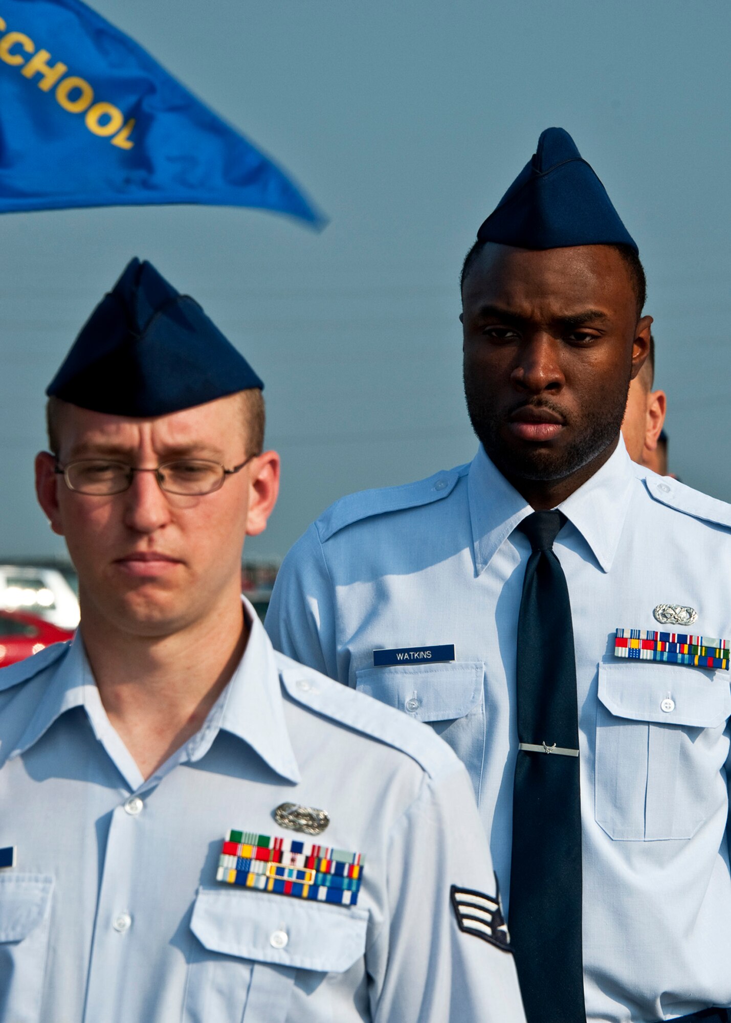 Senior Airmen David Mooers, 96th Communications Squadron, and Montez Watkins, 96th Logistics Readiness Squadron, stand in formation within Raptor flight prior to the morning Reveille ceremony at Eglin’s Airman Leadership School June 13.  ALS is a five-week-long Air Force program designed to develop Airmen into effective front-line supervisors.  It is the first professional military education enlisted Air Force members encounter. Eglin's schoolhouse hosts seven ALS classes per year.  Eglin was named Air Force Materiel Command's PME program of the year for 2009 and 2010. (U.S. Air Force photo/Samuel King Jr.)