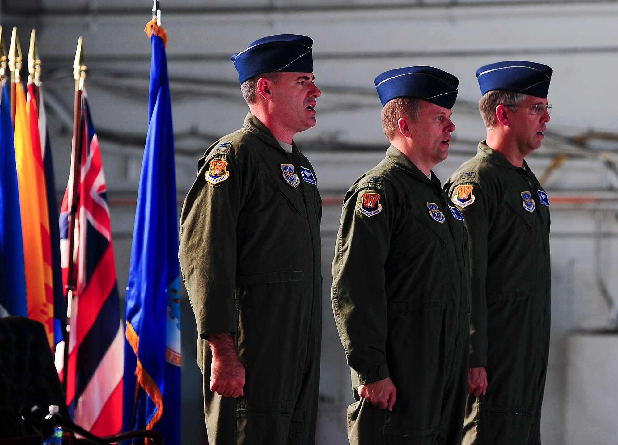 Col. Lenny Richoux, 6th Air Mobility Wing commander, Col. Matthew C. Molineux and Col. James “Slim” Morgan, 6th Operations Group commander,  sing the Air Force song loud and proud at the end of the  Change of Command ceremony at MacDill Air Force Base, Fla., June 13, 2011.  Colonel Morgan relinquished his command to Colonel Matthew C. Molineux. (US Air Force photo by Airman 1st Class Melanie Bulow-Gonterman/Released)
 

