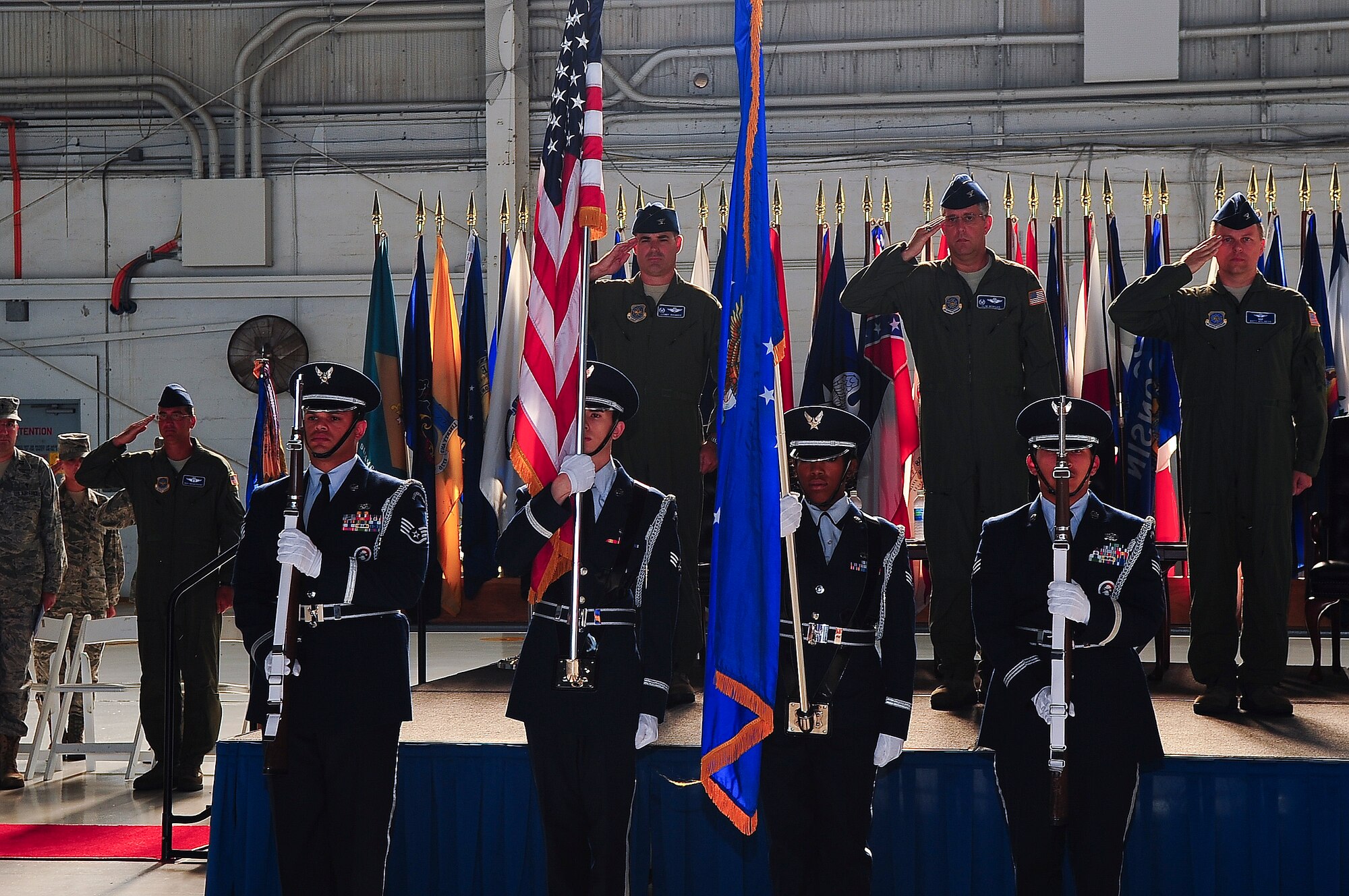 Col. Lenny Richoux, 6th Air Mobility Wing commander, Col. Matthew C. Molineux and Col. James “Slim” Morgan, 6th Operations Group commander,  salute the flag while the MacDill AFB Honor Guard posts the Colors at the Change of Command ceremony at MacDill Air Force Base, Fla., June 13, 2011.  Colonel Morgan relinquished his command to Colonel Matthew C. Molineux. (US Air Force photo by Airman 1st Class Melanie Bulow-Gonterman/Released)