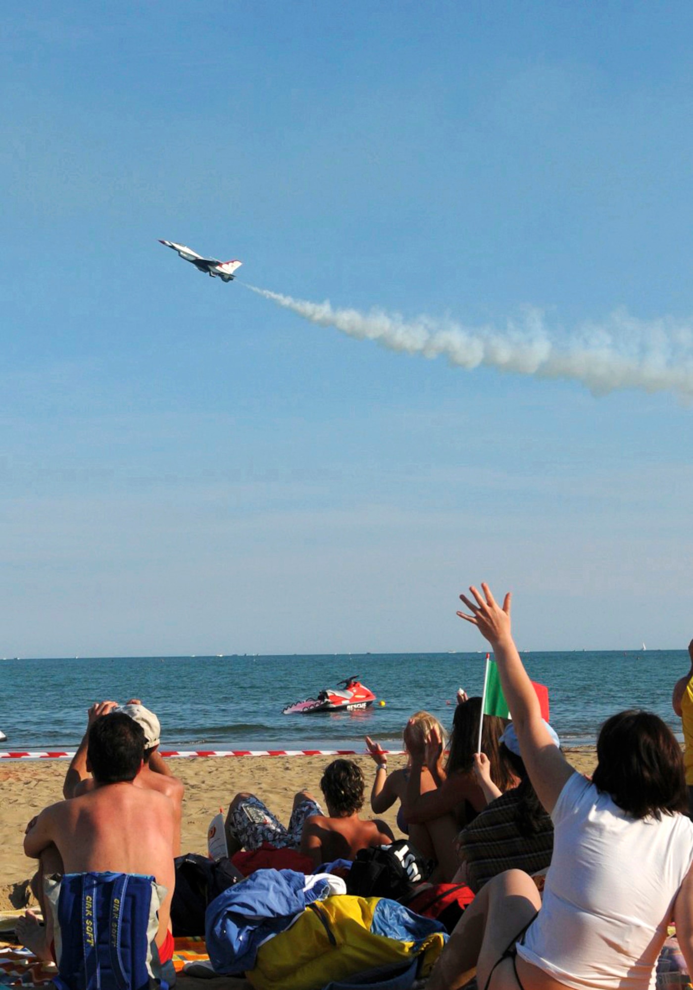 An Italian waves at a passing Air Force Thunderbird during the Air Extreme 2011 Airshow in Jesolo, Italy on June 11. (U.S. Air Force photo/Staff Sgt. Justin Weaver)
