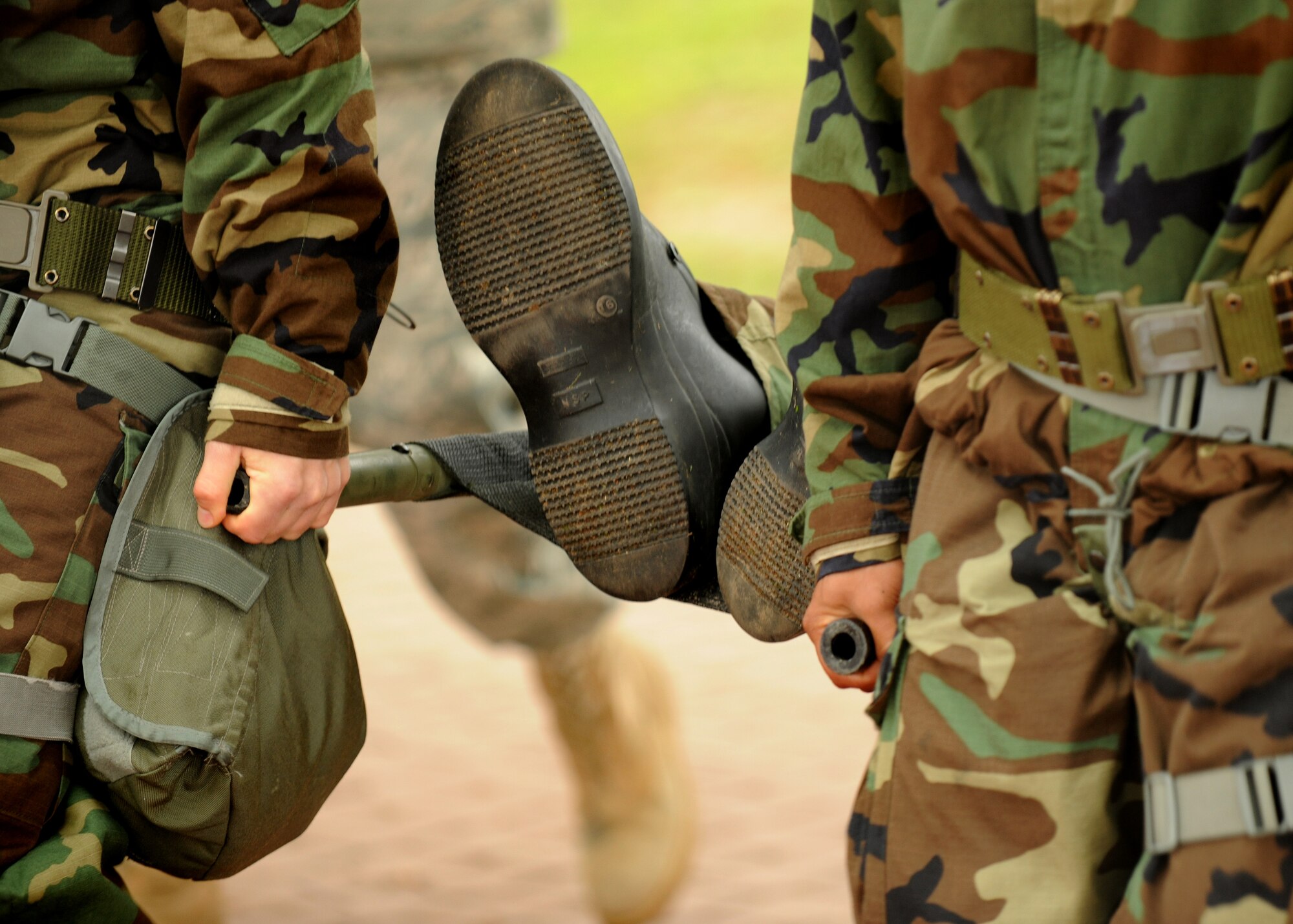 SPANGDAHLEM AIR BASE, Germany – Airmen from the 52nd Fighter Wing carry a simulated casualty during individual core competency skills training here June 13. The training reviewed individual chemical, biological, radiological and nuclear defense; weapon familiarization; first aid; and firefighting to prepare Airmen to operate in hostile environments. (U.S. Air Force photo/Senior Airman Nathanael Callon)
