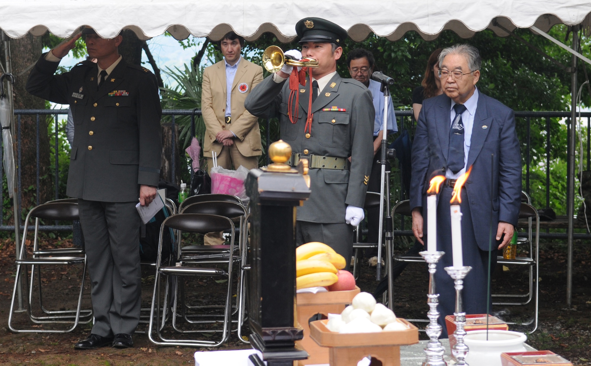 SHIZUOKA CITY, Japan -- A Japan Self Defense Force member plays taps during the B-29 remembrance ceremony held in Shizuoka City, Japan, June 11, 2011. Members from Yokota Air Base, Japan, attended the ceremony that honors the 23 fallen aircrew that died June 20, 1945, when two B-29s collided mid-air during an air raid on the city. (U.S. Air Force photo/Airman John D. Partlow)