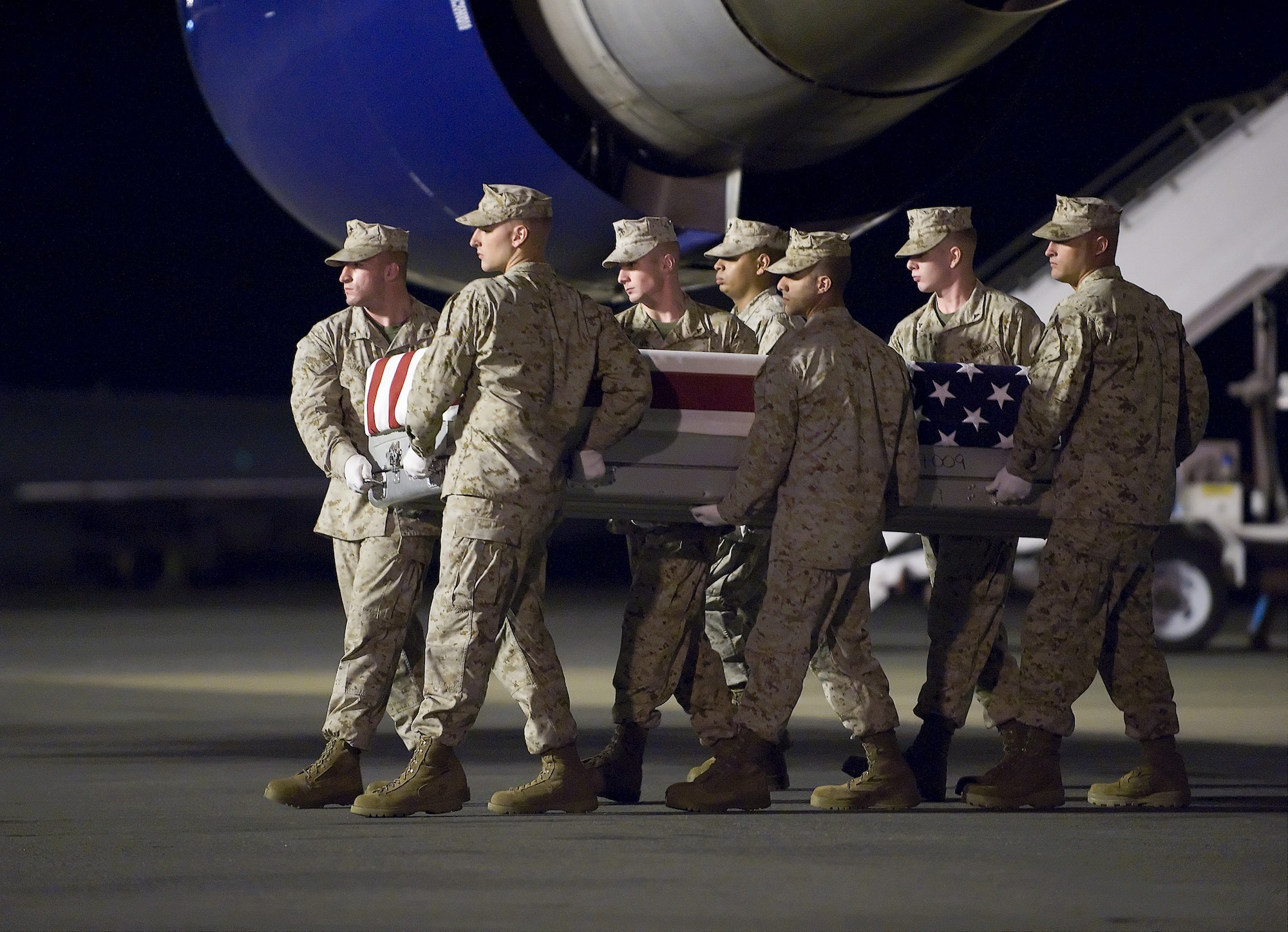 A U.S. Marine Corps carry team transfers the remains of Marine Lance Cpl. Sean M. N. O'Connor, of Douglas, Wyo., at Dover Air Force Base, Del., June 14, 2011. O'Connor was assigned to the 1st Battalion, 5th Marine Regiment, 1st Marine Division, I Marine Expeditionary Force, Camp Pendleton, Calif. (U.S. Air Force photo/Steve Kotecki)