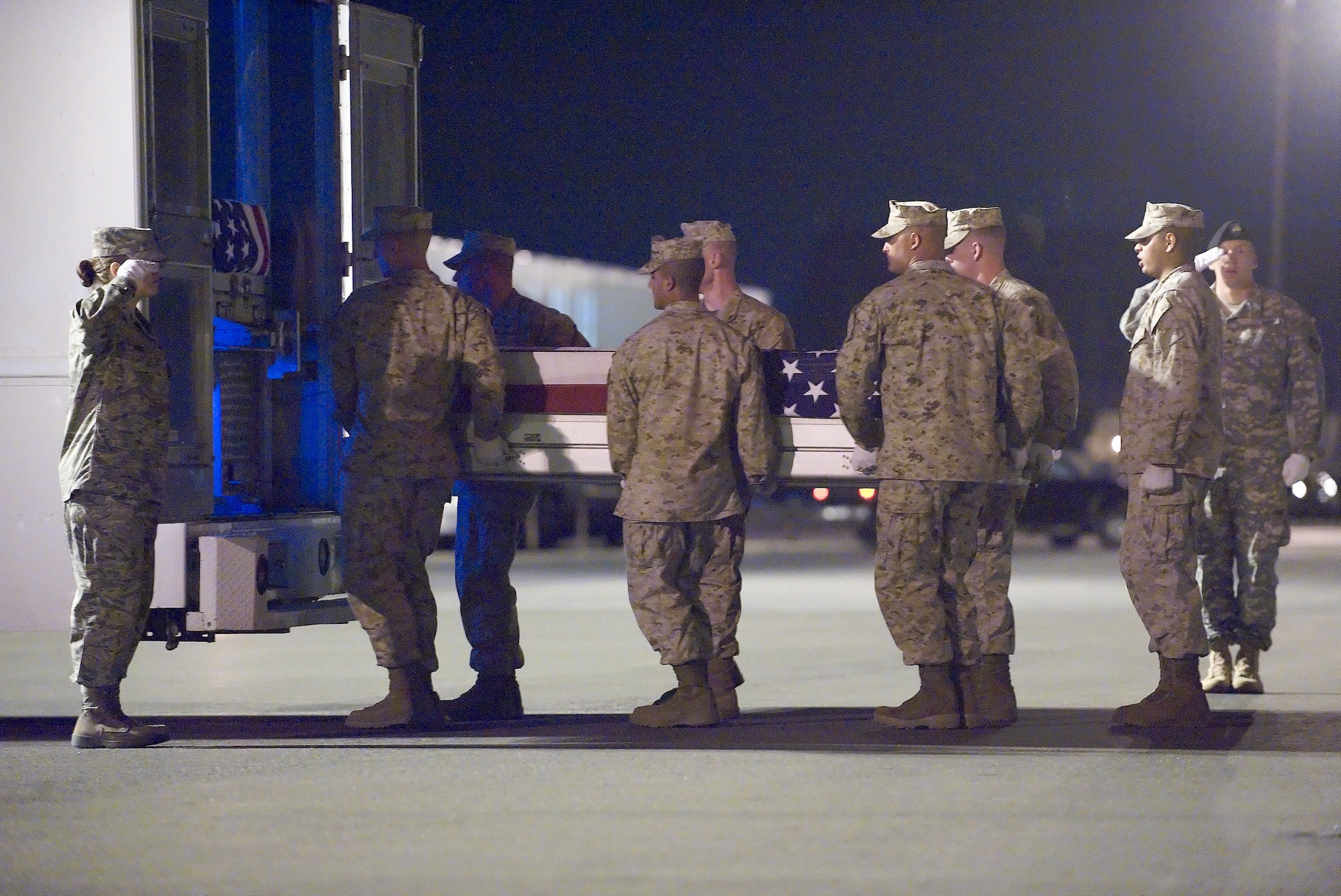 A U.S. Marine Corps carry team transfers the remains of Marine Lance Cpl. Joshua B. McDaniels, of Dublin, Ohio, at Dover Air Force Base, Del., June 14, 2011. McDaniels was assigned to the 2nd Combat Engineer Battalion, 2nd Marine Division, II Marine Expeditionary Force, Camp Lejeune, N.C. (U.S. Air Force photo/Steve Kotecki)