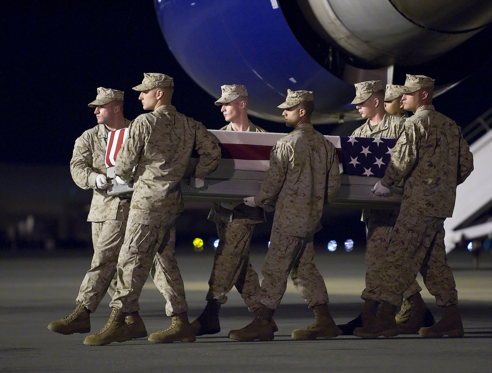 A U.S. Marine Corps carry team transfers the remains of Marine Lance Cpl. Jason D. Hill, of Poway, Calif., at Dover Air Force Base, Del., June 14, 2011. Hill was assigned to the 3rd Battalion, 4th Marine Regiment, 1st Marine Division, I Marine Expeditionary Force, Camp Pendleton, Calif. (U.S. Air Force photo/Steve Kotecki)