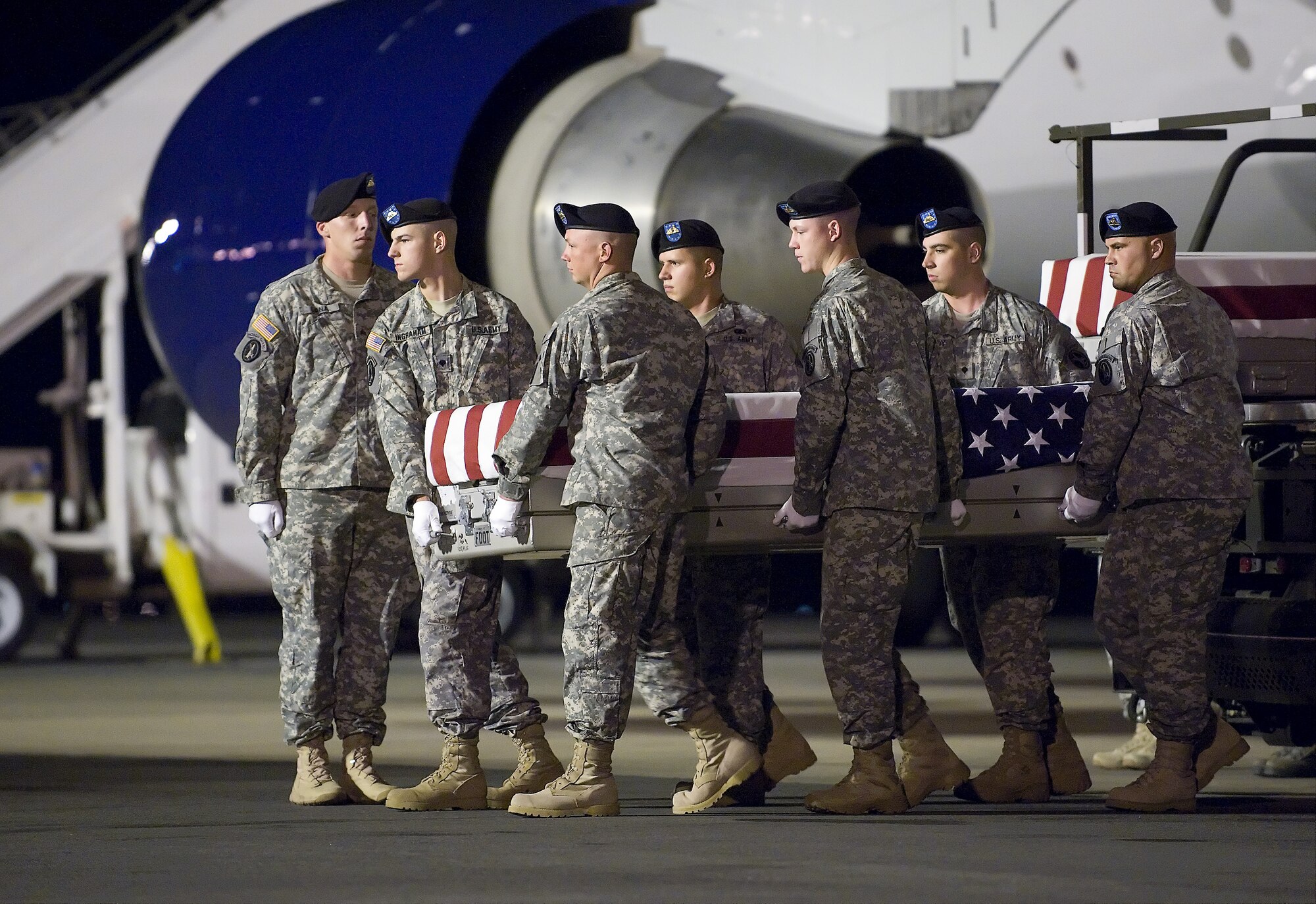 A U.S. Army carry team transfers the remains of Army Capt. Michael W. Newton, of Newport News, Va., at Dover Air Force Base, Del., June 14, 2011. Newton was assigned to the 1st Battalion, 84th Field Artillery Regiment, 170th Infantry Brigade Combat Team, Baumholder, Germany. (U.S. Air Force photo/Steve Kotecki)
