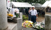 SHIZUOKA CITY, Japan -- A Japanese Navy veteran pilot salutes the B-29 monument during the annual B-29 remembrance ceremony held in Shizuoka City, Japan, June 11, 2011. Members from Yokota Air Base, Japan, attended the ceremony that honors the 23 fallen aircrew that died June 20, 1945, when two B-29s collided mid-air during an air raid on the city. (U.S. Air Force photo/Airman John D. Partlow)