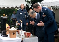 SHIZUOKA CITY, Japan -- Col. Todd Freece (right), 374th Mission Support Group commander, and Dr. Hiroya Sugano, the host of the annual B-29 remembrance ceremony, pay respects in front of a shrine in Shizuoka City, Japan, June 11, 2011. Members from Yokota Air Base, Japan, attended the ceremony that honors the 23 fallen aircrew that died June 20, 1945 when two B-29s collided mid-air during an air raid on the city. (U.S. Air Force photo/Airman John D. Partlow)