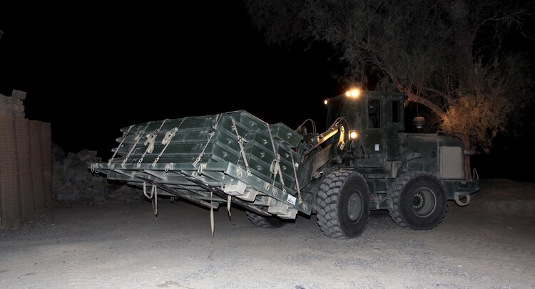 A Tractor Rubber-Tired Articulated Steering Multipurpose vehicle, or TRAM, carries a pallet of bridge pieces during an operation in the Gamsir district, Helmand province, Afghanistan, June 16, 2011.  The Marines placed a bridge over the Darvishan Bridge as a temporary fix to allow Afghan contractors to repair it without stopping traffic in the area.  This project will directly benefit the Marines of 1st Battalion, 3rd Marine Regiment, 2nd Marine Division (Fwd.) who are currently operating in the district in support of the International Security Assistance Force as well as the local population.