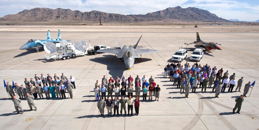 Members of the 98th Range Wing pose for a group photo on the Nellis Air Force Base flightline March 15. The 98th RANW was activated at Nellis Oct. 29, 2001 to operate, maintain and manage the NTTR complex.  On June 21, 2011, the 98th RANW was re-designated as The Nevada Test and Training Range -- a direct reporting unit to the U.S. Air Force Warfare Center. (U.S. Air Force photo by Airman 1st Class Jamie Nicley/Released) 
