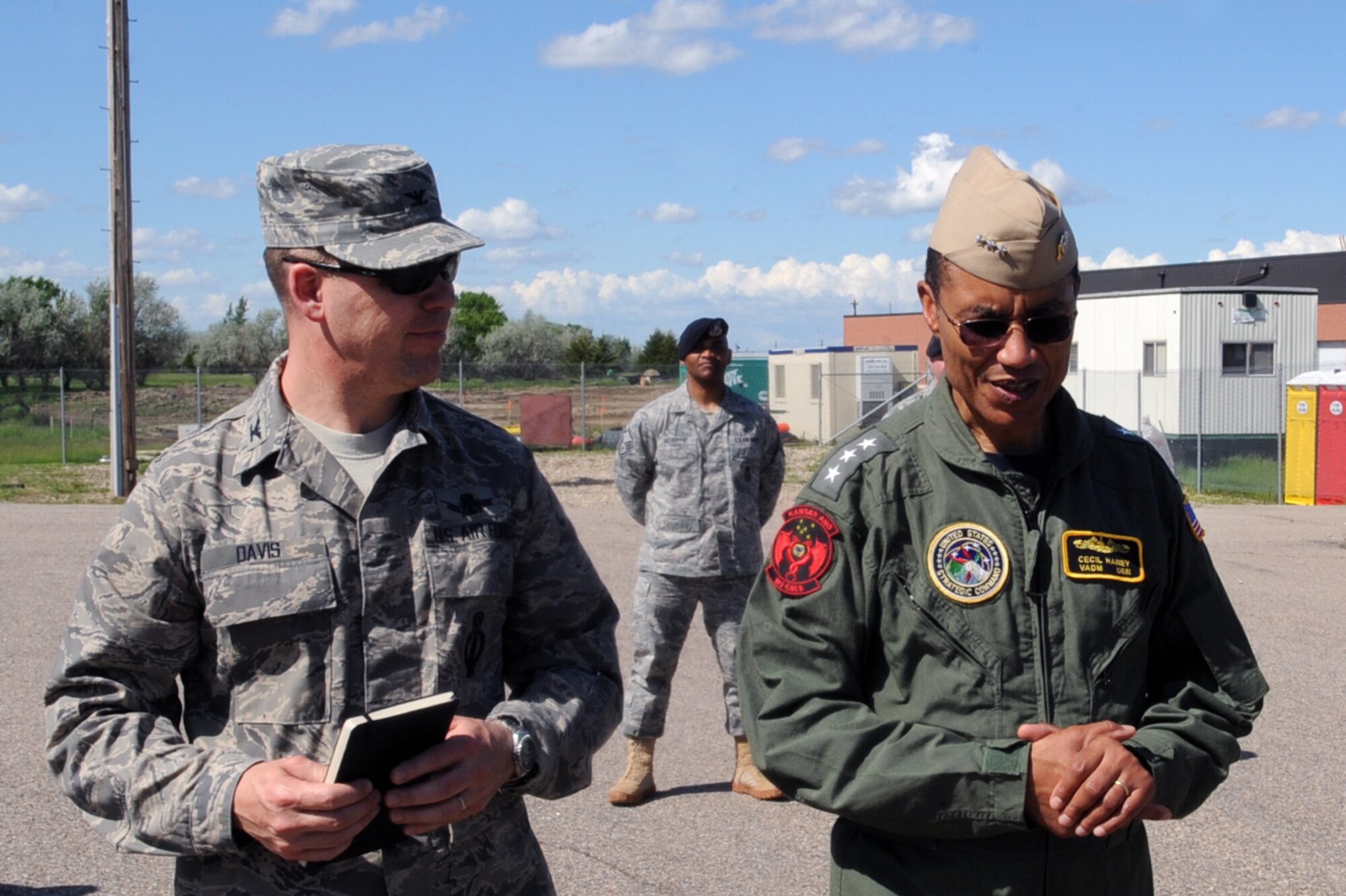 MINOT AIR FORCE BASE, N.D. -- Col. Stephen Davis, 91st Missile Wing commander, gives a tour of Uniform 1, a missile launch facility trainer for 91st Missile Wing Airmen to Vice Adm. Cecil Haney, U.S. Strategic Command deputy commander, during his visit to award team Minot with the Omaha trophy here June 17. Selections for the trophy are based on formal evaluations, meritorious achievement, safety, and other factors such as community involvement and humanitarian actions. (U.S. Air Force photo by Senior Airman Aaron-Forrest Wainwright)