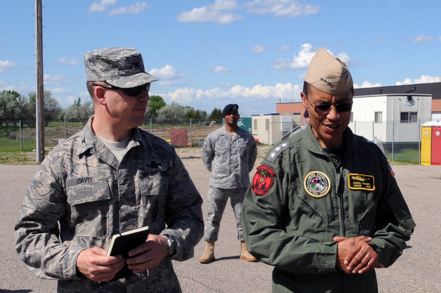 MINOT AIR FORCE BASE, N.D. -- Col. Stephen Davis, 91st Missile Wing commander, gives a tour of Uniform 1, a missile launch facility trainer for 91st Missile Wing Airmen to Vice Adm. Cecil Haney, U.S. Strategic Command deputy commander, during his visit to award team Minot with the Omaha trophy here June 17. Selections for the trophy are based on formal evaluations, meritorious achievement, safety, and other factors such as community involvement and humanitarian actions. (U.S. Air Force photo by Senior Airman Aaron-Forrest Wainwright)