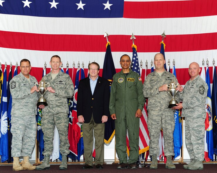 MINOT AIR FORCE BASE, N.D. -- Base leadership were presented Omaha Trophies by Mark Theisen, U.S. Strategic Command Consultation Committee representative, and Vice Adm. Cecil Haney, U.S. Strategic Command deputy commander, here June 15. The 5th Bomb Wing and the 91st Missile Wing received recognition for their hard work and dedication by receiving the Omaha Trophy for the Best Strategic Aircraft Operations and the Best Intercontinental Ballistic Missile respectively. The Omaha Trophy is awarded annually to military units demonstrating the highest performance standards in U.S. STRATCOM. (U.S. Air Force photo/Senior Airman Michael J. Veloz)
