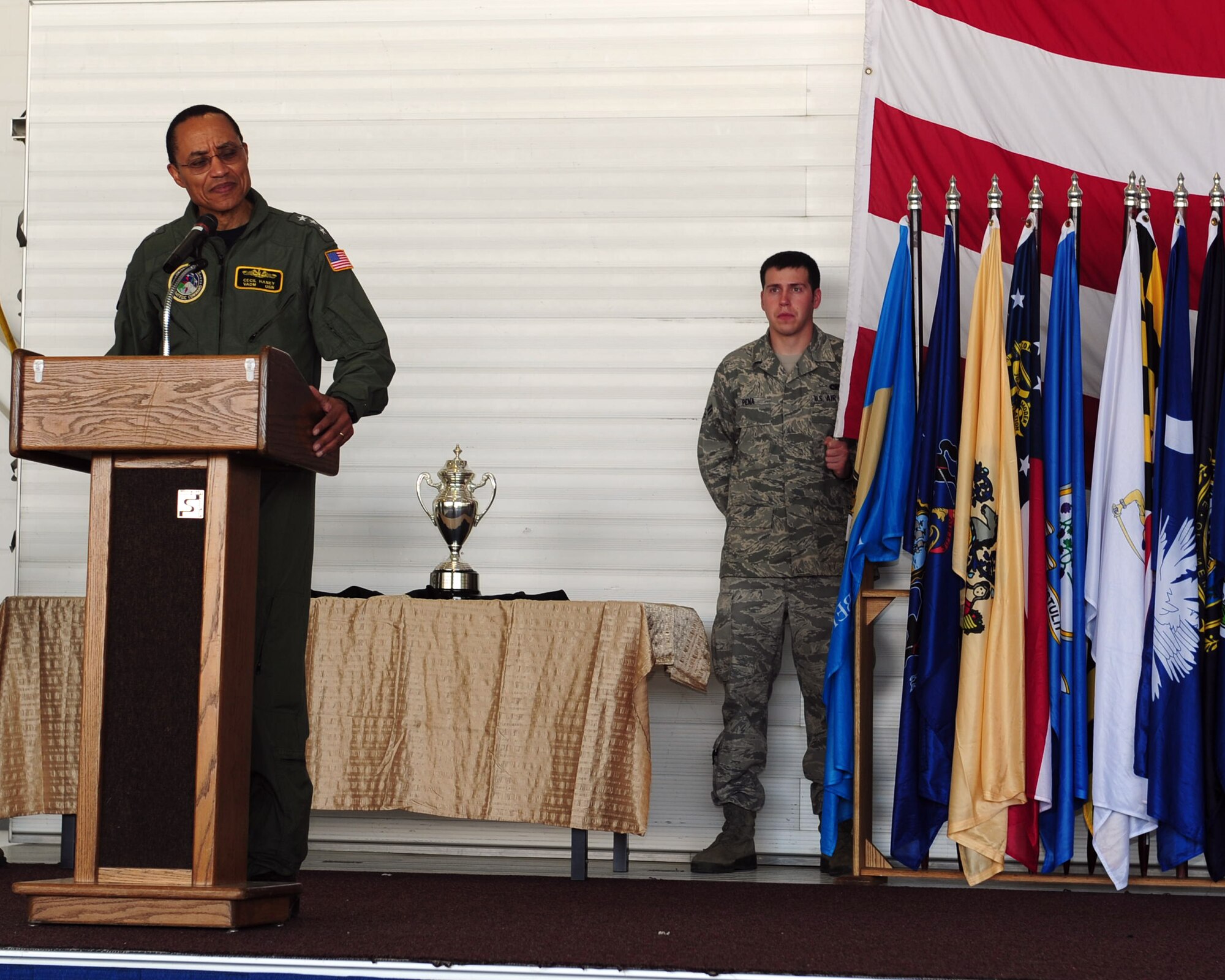 MINOT AIR FORCE BASE, N.D. -- Vice Adm. Cecil Haney, U.S. Strategic Command deputy commander, speaks to Airmen of Team Minot at an all-call here June 15. Team Minot received recognition for their hard work and dedication by receiving the Omaha Trophy for the best intercontinental ballistic missile and best strategic aircraft operations. The Omaha Trophy is awarded annually to military units demonstrating the highest performance standards in U.S. STRATCOM. (U.S. Air Force photo/Senior Airman Michael J. Veloz)