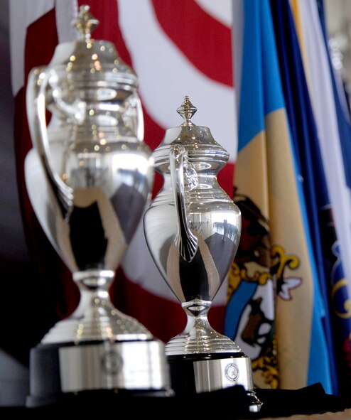 MINOT AIR FORCE BASE, N.D. -- Trophies wait to be presented to the 5th Bomb Wing and the 91st Missile Wing at an all-call here June 15. Team Minot received recognition for their hard work and dedication by receiving the Omaha Trophy for the best intercontinental ballistic missile and best strategic aircraft operations. The Omaha Trophy is awarded annually to military units demonstrating the highest performance standards in U.S. STRATCOM. (U.S. Air Force photo/Staff Sgt. John Comer)