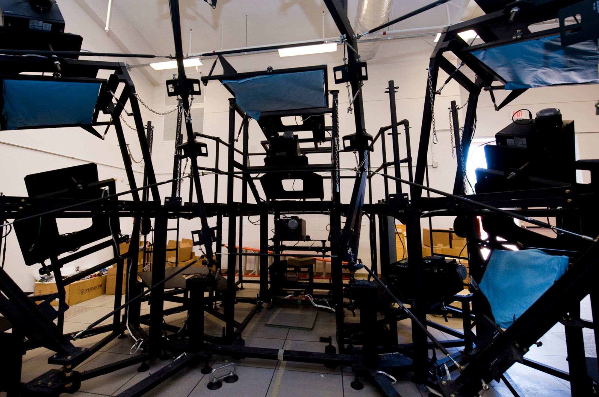 NELLIS AIR FORCE BASE, Nev.-- The outer frame of the new F-16 Falcon Mission Training Center flight simulator stands completed during the installation phase June 13. The simulator will allow F-16 Falcon pilots to practice aerial maneuvers, formations, and air-to-air combat with a 360 degree view.  This simulator is one of four to be constructed at Nellis.  (U.S Air Force photo by Senior Airman Stephanie Rubi)