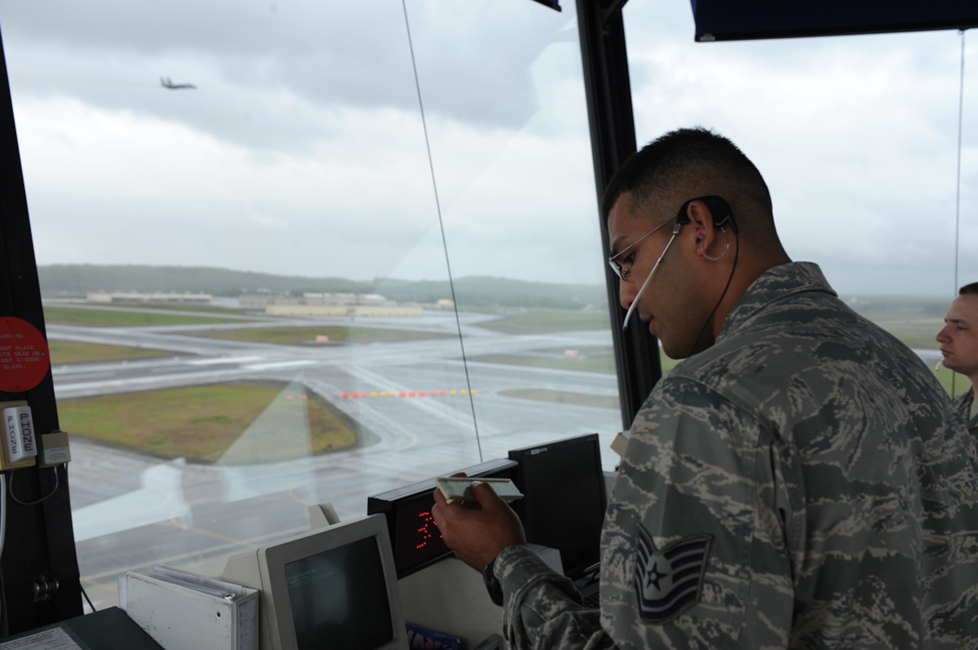 Air Force Tech. Sgt. Jorge Riviera, air traffic controller, issues flight clearances for fighter jets preparing to launch for in support of Exercise Northern Edge 11 in Joint Base Elmendorf-Richardson, Alaska, June 14. Northern Edge, Alaska's largest military training exercise, is designed to prepare joint forces to respond to crises throughout the Asia-Pacific region. (Photo by Mass Communication Specialist 2nd Class Rufus Hucks)