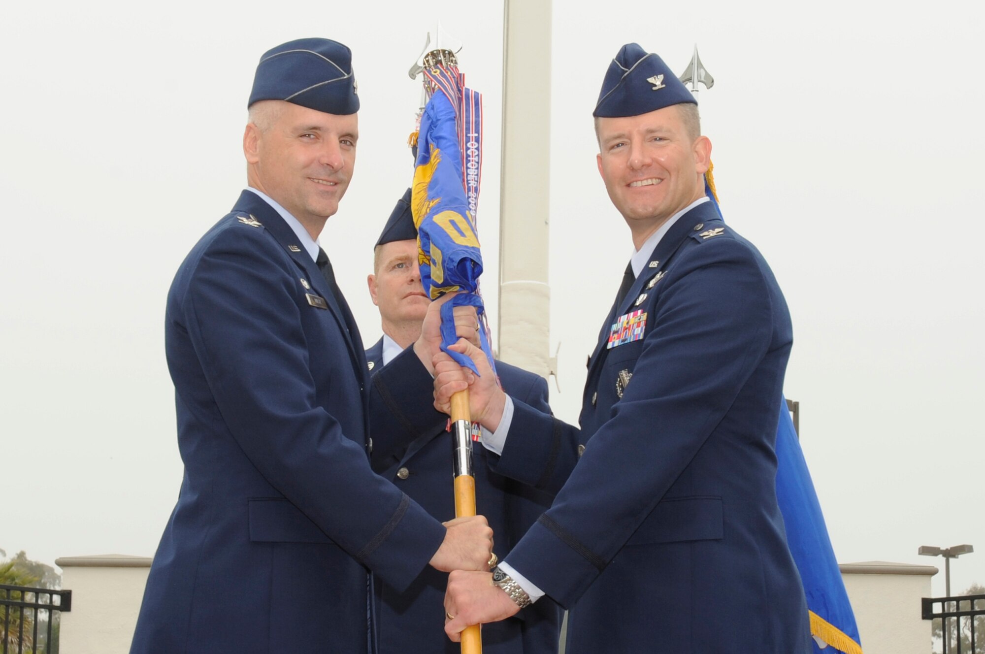 VANDENBERG AIR FORCE BASE, Calif. – Col. David Hook, the 30th Operations Group commander, accepts the guidon from Col. Richard Boltz, the 30th Space Wing commander, during a change of command ceremony here Wednesday, June 15, 2011. The change of command ceremony historically has provided a way for the soldiers to visually recognize their incoming commander. (U.S. Air Force photo/Senior Airman Lael Huss)
