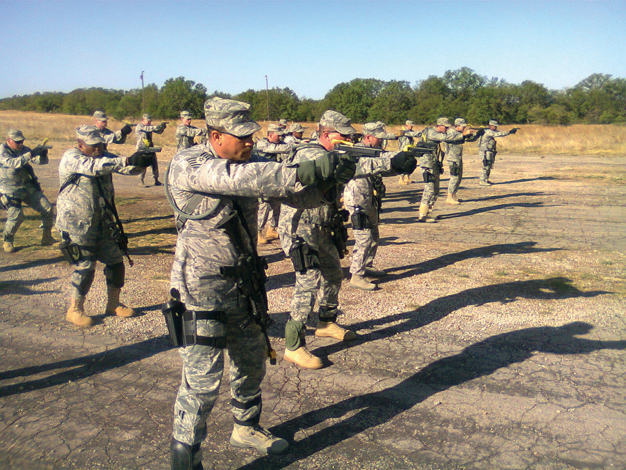 Members of the 908th SFS practice weapons transitioning from the M-4 rifle to the M-9 pistol during their recent participation in Patriot Defender.