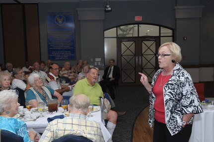 Judith Markelz, Warrior and Family Support Center Director, Fort Sam Houston, Texas, speaks to members of Hangar Doors are Open, 15 June.  The center provides many programs and promotes donations for its wounded warriors. (U.S. Air Force photo/Joel Martinez)