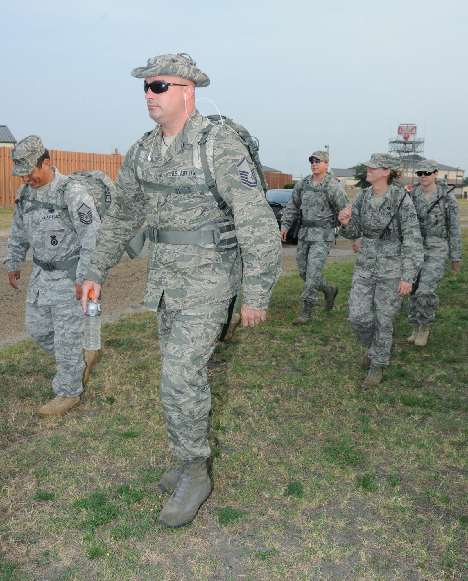 Members of the 81st SFS begin their 5-mile training march around the base to prepare for their 148-mile ruck march to honor fallen heroes. The march will begin at Lackland AFB, Texas, proceed through Shanksville, Pa., and end in New York City in time for the 10th anniversary ceremony Sept. 11.  (U.S. Air Force photo by Kemberly Groue)