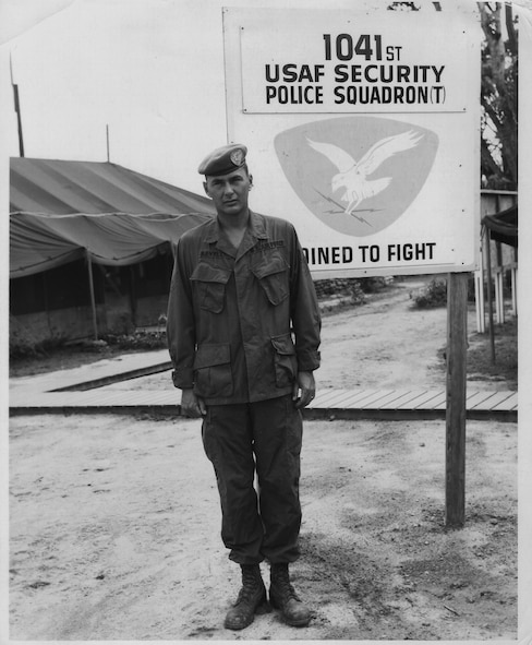 Retired Master Sgt. Bill Revell stands in front of a 1041st Security Police Squadron (test) sign at Phu Cat Air Base, Vietnam, in 1967. After attending the U.S. Army Ranger School, Sergeant Revell became a cadre and trained new members of the 1041st SPS. (Courtesy photo) 