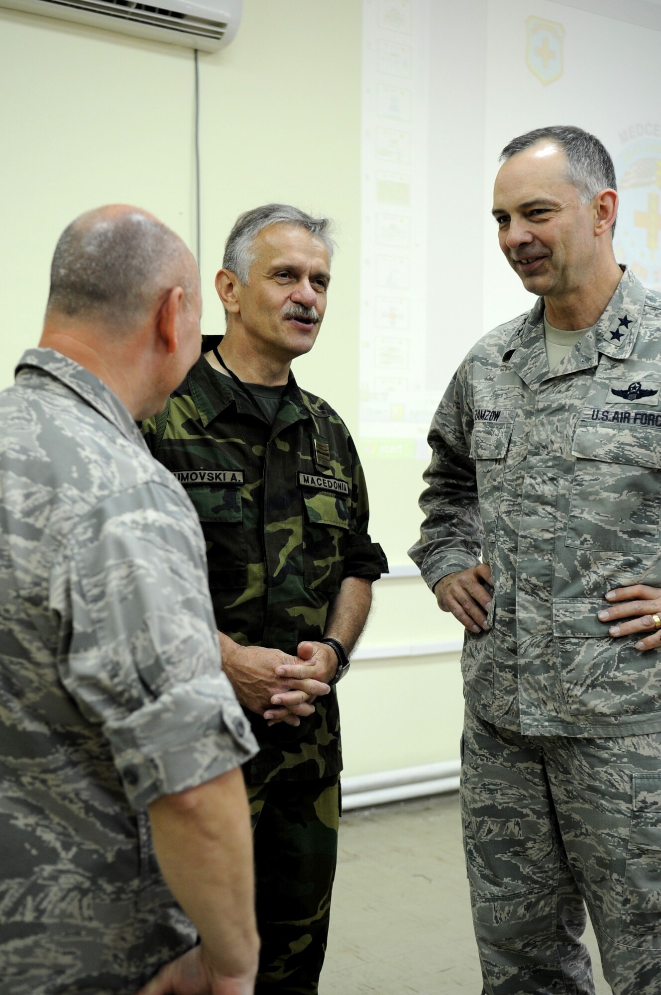 CAMP PEPELISHTE, Macedonia -- Left, Col.  Charles Tedder, American co-director of the 2011 Medical Training Exercise in Central and Eastern Europe, Col. Andreja Naumovski, Macedonian co-director of MEDCEUR 2011 and Maj. Gen. Mark Zamzow, 3rd Air Force vice commander, discuss plans for future MEDCEUR exercises during the MEDCEUR 2011 distinguished visitor day June 13. An annual Chairman of the Joint Chiefs of Staff-sponsored regional and multilateral exercise, MEDCEUR is designed to provide medical training and operational experience in a deployed environment for U.S. and partner nations. The countries participating in this year's MEDCEUR are Macedonia, Montenegro, Bosnia and Herzegovina, Serbia, Slovenia and Norway. (U.S. Air Force photo/Staff Sgt. Nadine Y. Barclay)