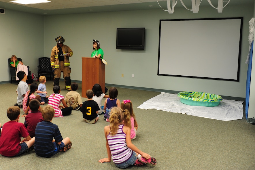 Marcus Haynes, a firefighter with the Valdosta Fire Department, talks to children about fire safety during the Wild Bible Adventure class during Vacation Bible School at Moody Air Force Base, Ga., June 14, 2011. Mr. Haynes reminded kids not to play with fire and explained to them what they should do in the event of a fire. (U.S. Air Force Senior Airman Stephanie Mancha/Released)