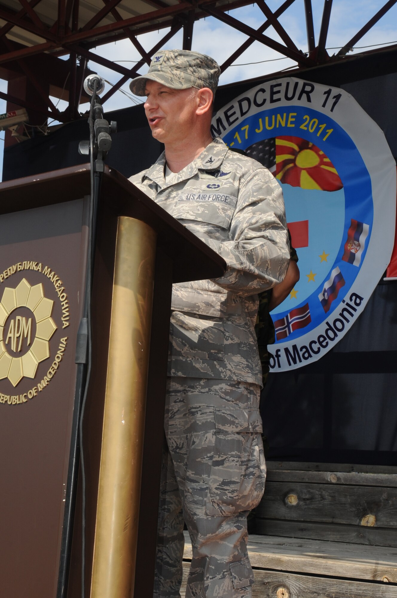 CAMP PEPELISHTE, Macedonia ? Col. (Dr.) Charles Tedder, 2011 Medical Training Exercise in Central and Eastern Europe co-director and 3rd Air Force command surgeon addresses the participants of MEDCEUR 11 during the closing ceremonies June 15. An annual Chairman of the Joint Chiefs of Staff-sponsored regional and multilateral exercise, MEDCEUR is designed to provide medical training and operational experience in a deployed environment for U.S. and partner nations. The countries participating in this year's MEDCEUR are Macedonia, Montenegro, Bosnia and Herzegovina, Serbia, Slovenia and Norway. (U.S. Air Force photo/Staff Sgt. Nadine Y. Barclay)