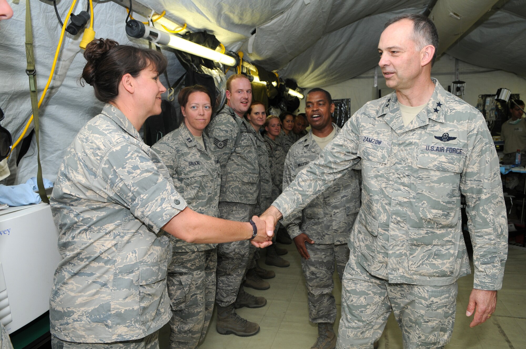 CAMP PEPELISHTE, Macedonia -- Right, Maj. Gen. Mark Zamzow, 3rd Air Force vice commander, shakes the hand of Maj. Cindy Harris, 86th Medical Group nurse, during his visit to the 2011 Medical Training Exercise in Central and Eastern Europe June 13. General Zamzow was here to observe MEDCEUR 11. An annual Chairman of the Joint Chiefs of Staff-sponsored regional and multilateral exercise, MEDCEUR is designed to provide medical training and operational experience in a deployed environment for U.S. and partner nations. The countries participating in this year's MEDCEUR are Macedonia, Montenegro, Bosnia and Herzegovina, Serbia, Slovenia and Norway. (U.S. Air Force photo/Staff Sgt. Julius Delos Reyes)