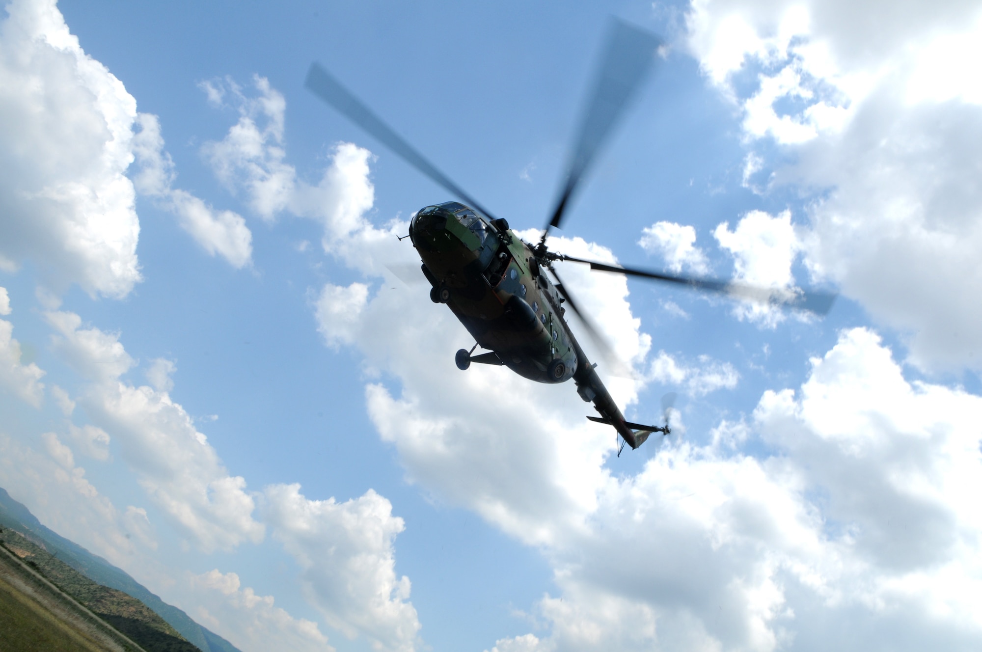 CAMP PEPELISHTE, Macedonia -- A Macedonian MI-17 hovers in preparation to depart with a simulated medical evacuation patient as part of a showcase for numerous multinational distinguished visitors to the 2011 Medical Training Exercise in Central and Eastern Europe June 13. An annual Chairman of the Joint Chiefs of Staff-sponsored regional and multilateral exercise, MEDCEUR is designed to provide medical training and operational experience in a deployed environment for U.S. and partner nations. The countries participating in this year's MEDCEUR are Macedonia, Montenegro, Bosnia and Herzegovina, Serbia, Slovenia and Norway. (U.S. Air Force photo/Staff Sgt. Julius Delos Reyes)