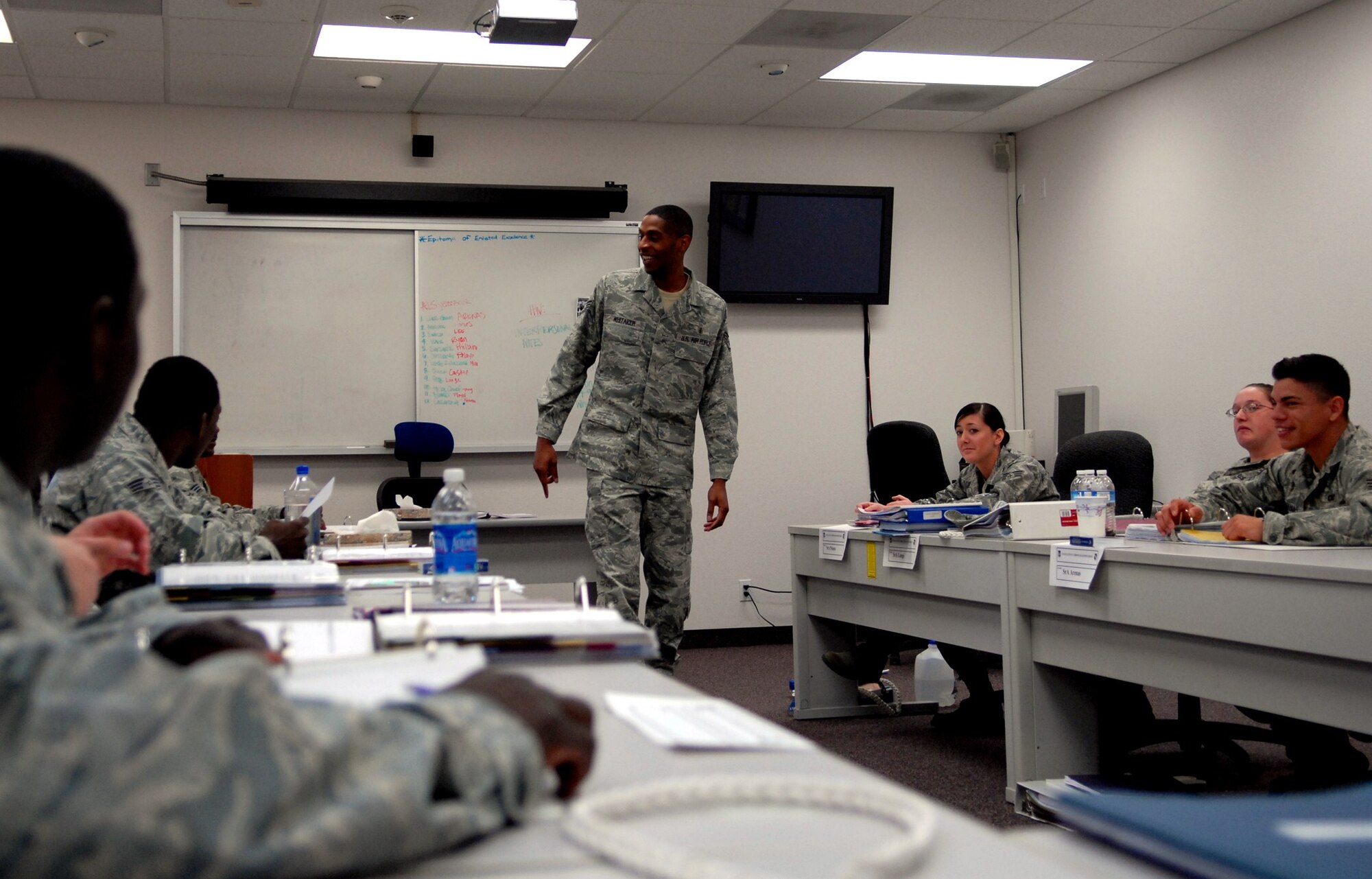 Staff Sgt. Sedric Whitaker, 95th Force Support Squadron Airman Leadership School flight instructor, leads a class full of senior airmen in a discussion. Sergeant Whitaker not only uses his leadership skills to help foster the careers of younger airmen, but also to compete on the basketball court. He has been a part of the All-Air Force team since 2006. (Air Force photo by Kate Blais)