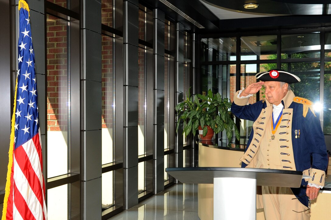 Retired U.S. Air Force Maj. Frank Jackson, Heroes of ‘76 member, salutes the flag during the “Old Glory Speaks” program, honoring Flag Day at Langley Air Force Base, Va., June 14, 2011. Flag Day commemorates the adoption of the flag of the United States by the resolution of the Second Continental Congress in 1777. (U.S. Air Force photo by Airman 1st Class Racheal Watson/Released)